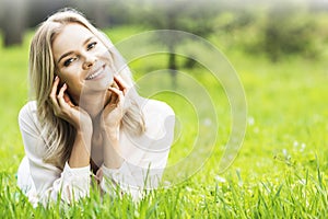 Blond girl relaxing in park