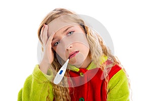 Blond girl with thermometer and flu cold in pyjama