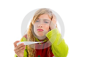Blond girl with thermometer and flu cold in pyjama