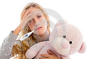 Blond girl with thermometer and flu cold in pyjama