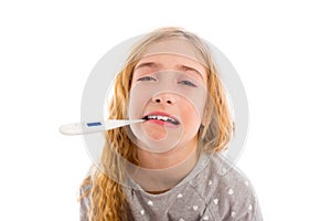 Blond girl with thermometer and flu cold in pyjama