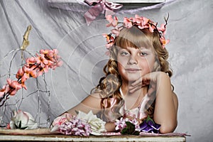 Blond girl with white flowers in her hair