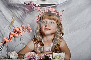 Blond girl with white flowers in her hair