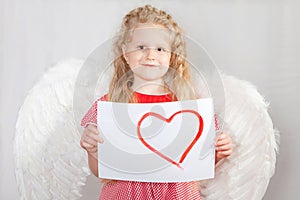 The blond girl with wings of an angel in a Valentine's Day card