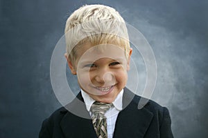 Blond grinning business boy