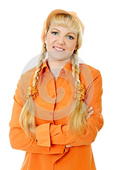 Blond hair and blue eyes girl in orange blouse and cap folds arms