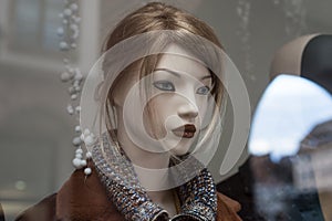 blond hair mannequin in a women fashion store showroom