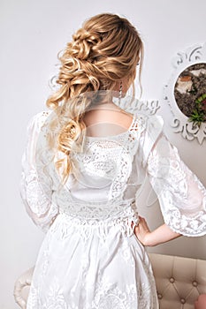 Blond hair womam in white dress