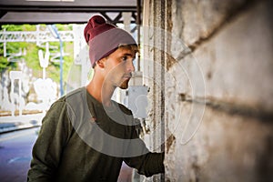 Blond handsome young man with wool hat