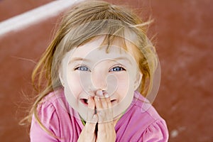 Blond happy smiling little girl excited laugh