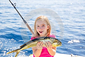 Blond kid girl fishing Dorado Mahi-mahi fish happy catch