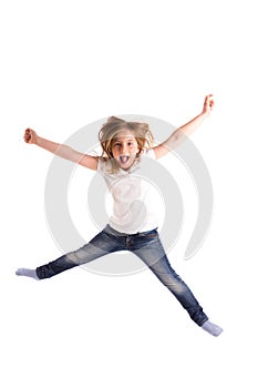 Blond kid girl indented jumping high wind on hair