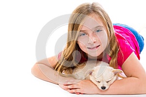 Blond kid girl with puppy chihuahua pet dog