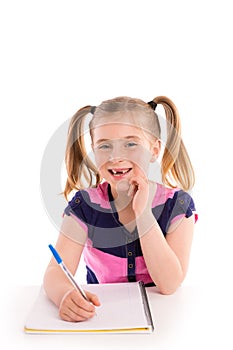 Blond kid girl student with spiral notebook in desk