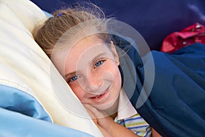 Blond kid girl tired relaxed smiling indented