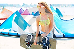 Blond kite surf teen girl in summer beach