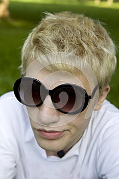 Blond man in funny sun glasses
