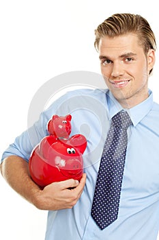 Blond man holding piggybanks