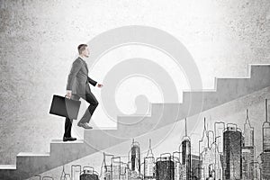 Blond man with suitcase climbing stairs