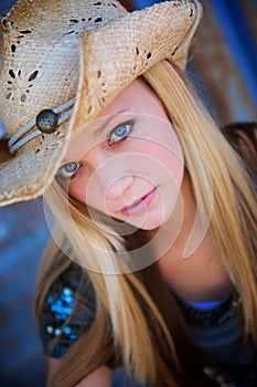 Blond Model Smiles While Wearing Cowboy Hat