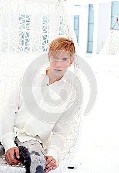 Blond modern man portrait in summer terrace photo