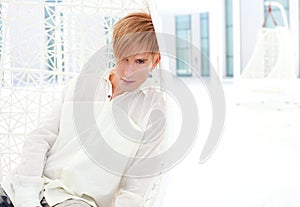 Blond modern man portrait in summer terrace photo