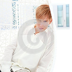 Blond modern man portrait in summer terrace photo