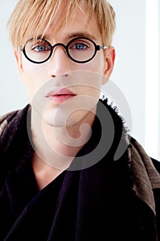 Blond modern student man with nerd glasses