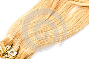 Blond natural hair extension isolated on white