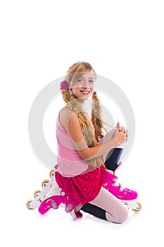 Blond pigtails roller skate girl on her knees happy