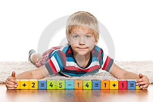 Blond preschool boy with blocks