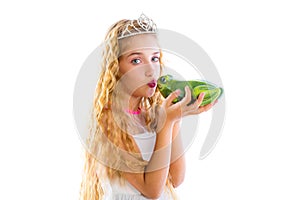 Blond princess girl kissing a frog green toad