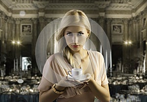 Blond sensual woman with a coffee cup