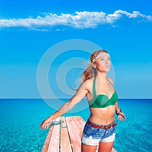 Blond tourist girl in tropical beach Formentera