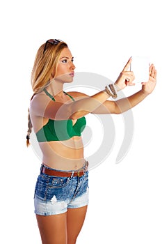 Blond short jeans woman selfie tablet photo