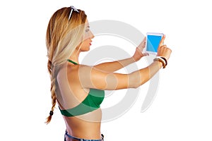 Blond short jeans woman selfie tablet photo