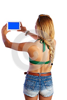 Blond short jeans woman selfie tablet photo