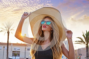 Blond teen girl sunglasses and pamela sun hat