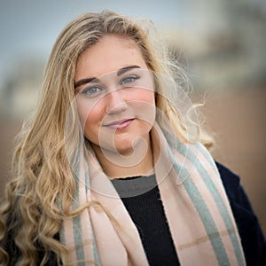 Blond Teenage Girl With Scarf and Woolly Jumper