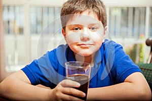 Blond tween drinking soda