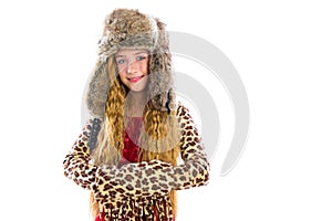 Blond winter kid girl long hair with fur clothes