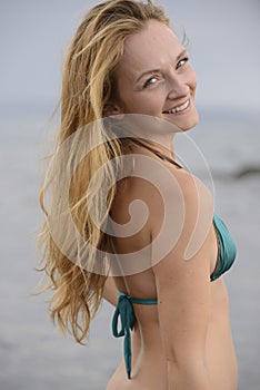 Blond woman in bikini on the beach