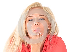 Blond woman blowing kiss