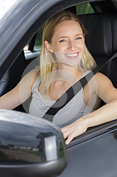 blond woman in car