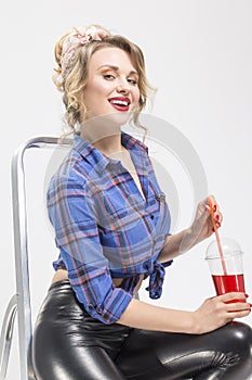 Blond Woman in Checked Shirt and Latex Pants Posing On Ladder