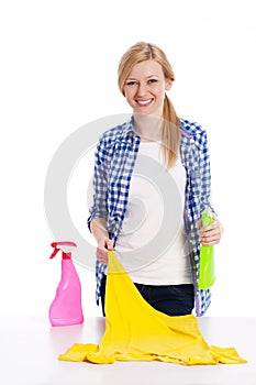 Blond woman with cleaning stuff