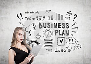 Blond woman with a cleavage and business plan