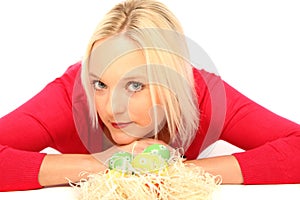 Blond woman with easter eggs