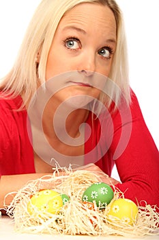 Blond woman with easter eggs