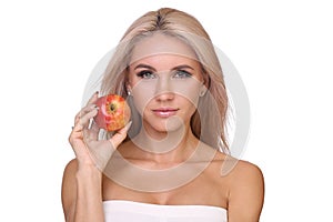 Blond woman eat red apple